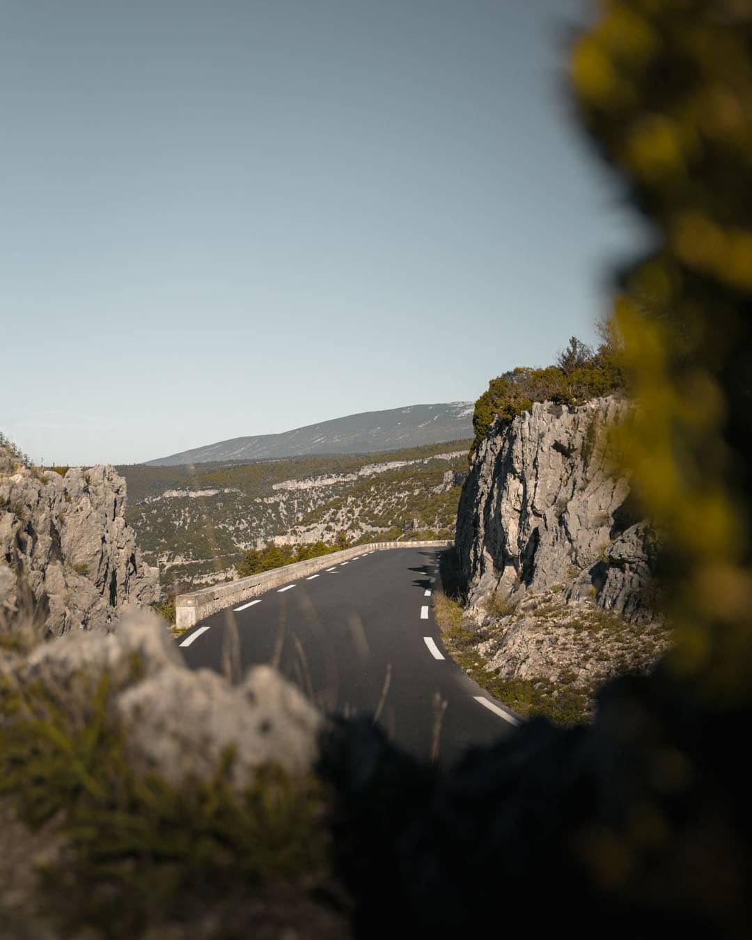 A winding road through rugged rocky terrain on Ventoux, capturing the beauty and challenge of this renowned cycling destination.